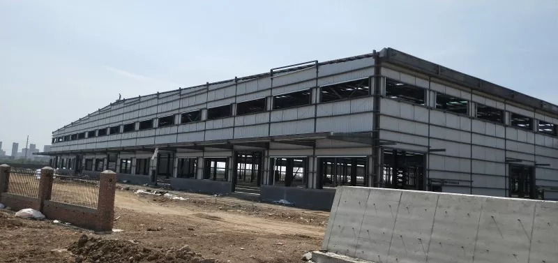 Togail taigh-bathair Logistics Frame Steel Modular Prefab